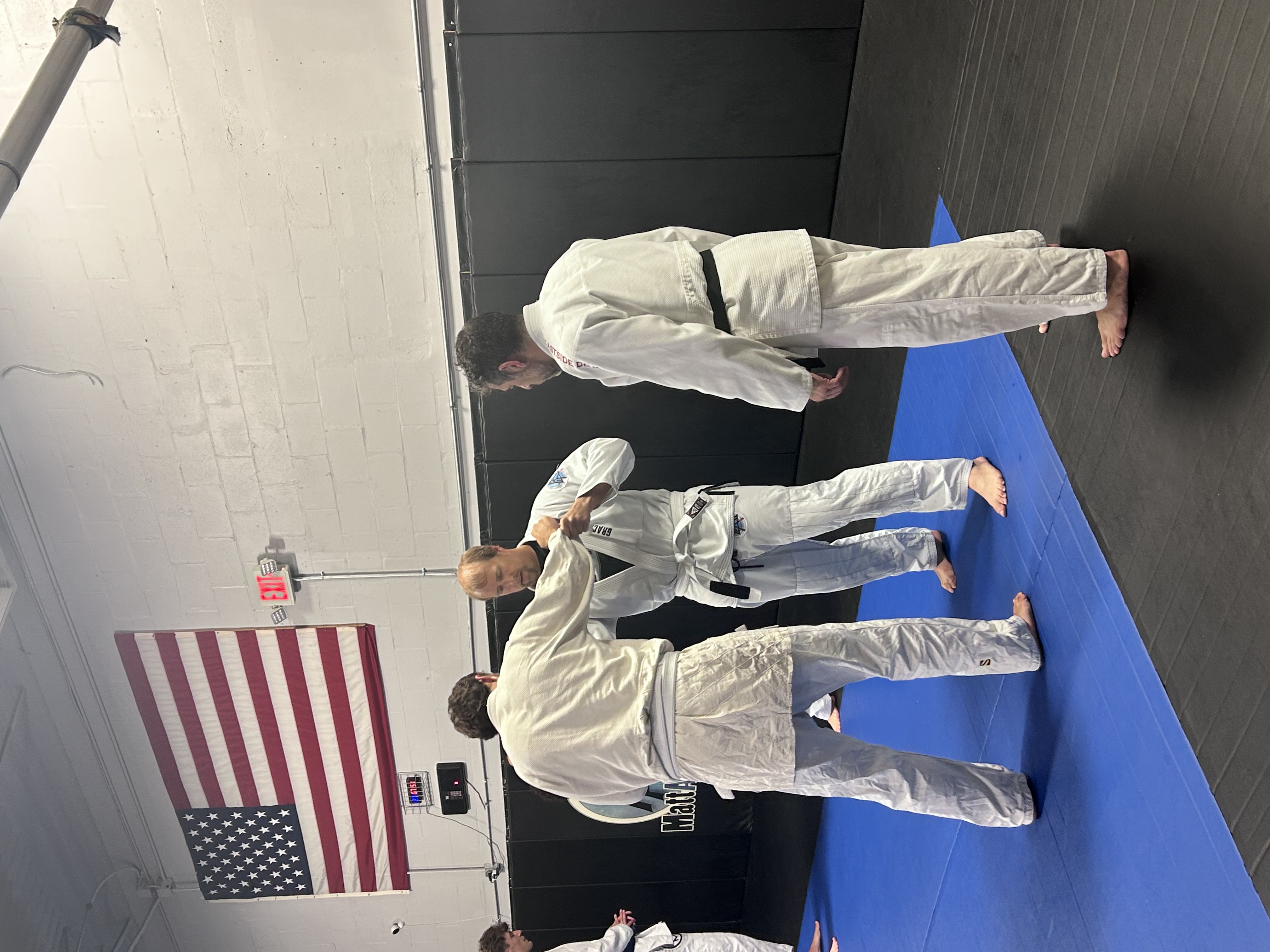 Hughey's Judo students training together on the mat at Gracie Tampa South